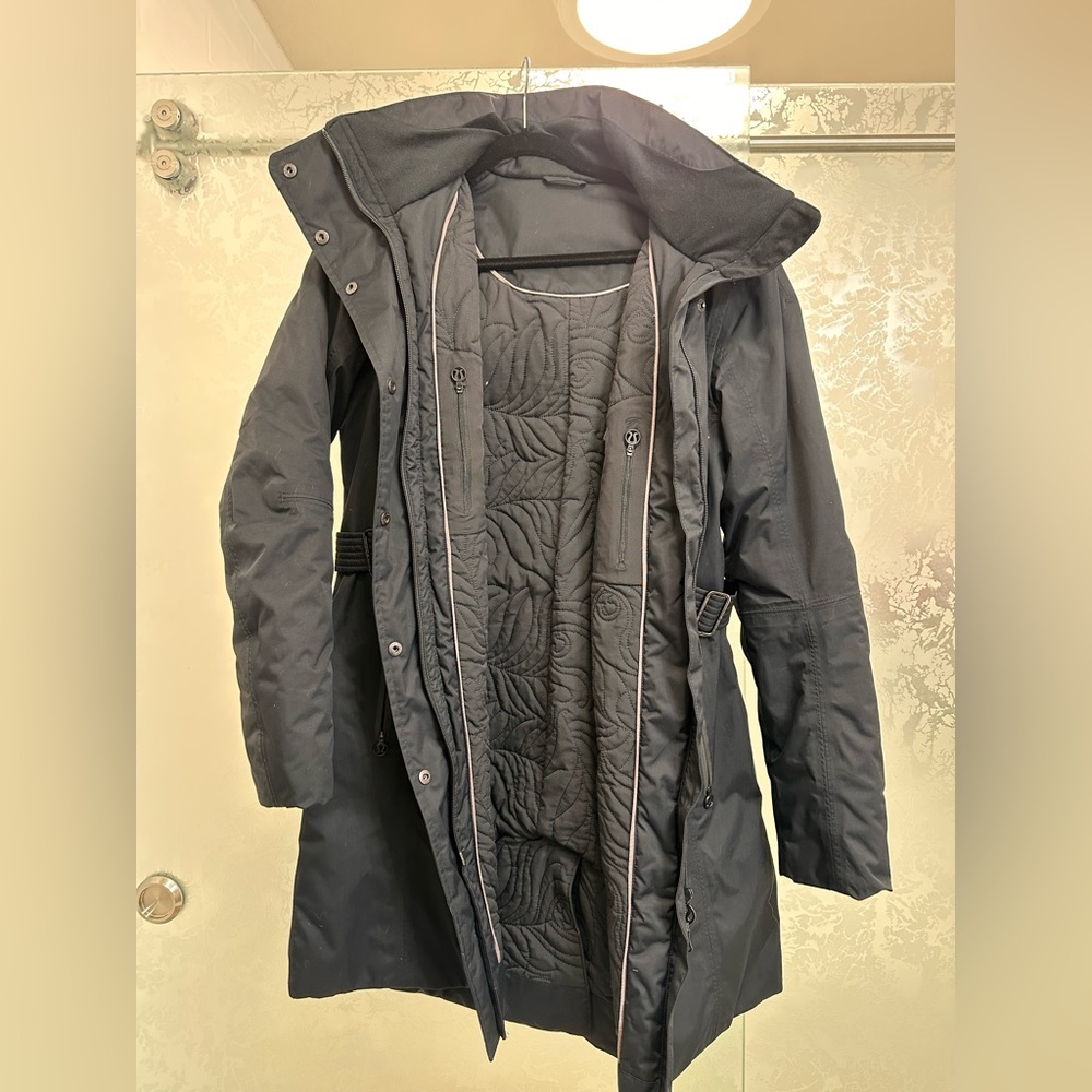 Long hooded lulu lemon jacket with adjustable sides.